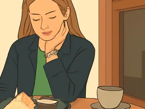Flat vector illustration of a person with long hair in a dark jacket and green top at a table, eyes lowered and chin resting on their hand, with a plate of food and a cup in front of them and a window beside them.