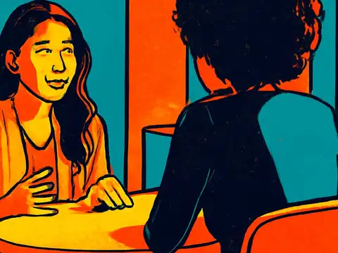 Two people sitting across a small round table in conversation, one gesturing while talking, rendered as a flat orange and teal illustration.
