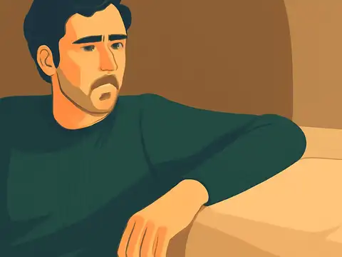 Flat vector illustration of a man with dark hair and a short beard in a dark green ribbed sweater, leaning on one arm beside a cushion, with a worried, faraway expression against warm brown walls.