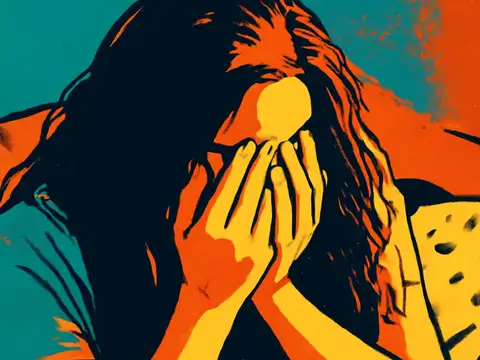 Pop-art illustration of a person sitting on a sofa with their face in both hands, hair falling forward.